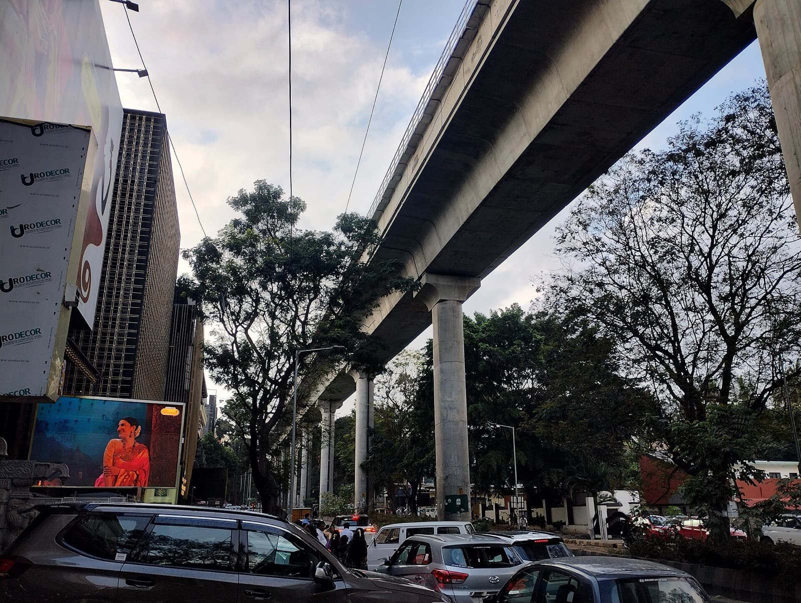 The Namma Metro viaduct over a tree-lined road in Jayanagar, Bengaluru
